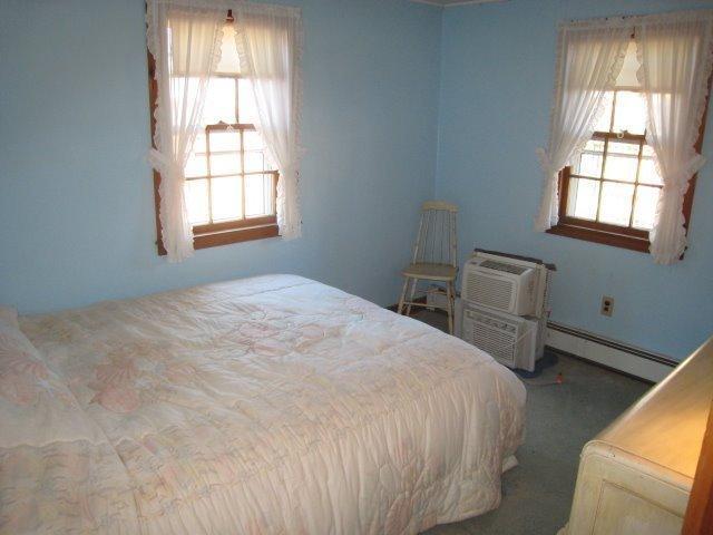 84 Uncle Rolf Road Dennis Port, MA 02639 - Photo 9 of 16 a bedroom with a bed and a window