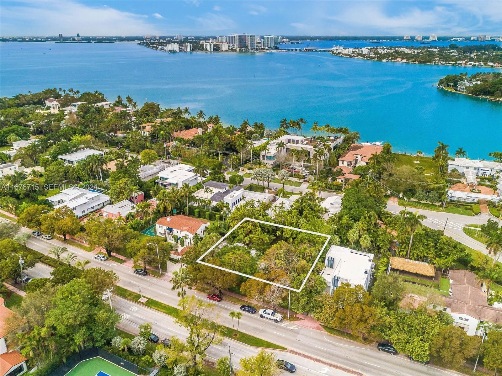 6080 Alton Road Miami Beach, FL 33140 - Photo 2 of 11 an aerial view of ocean with residential house with outdoor space