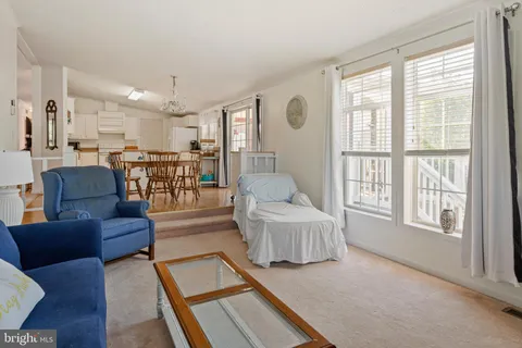 a bedroom with a bed and a flat tv screen on dresser