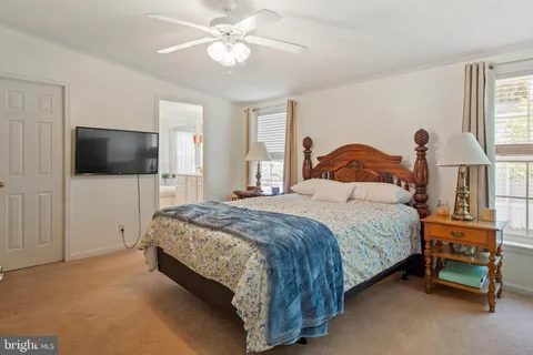 a bedroom with a bed and a dresser in it