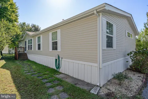 an aerial view of a house with yard swimming pool and outdoor seating