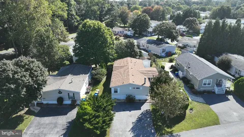 an aerial view of house with yard
