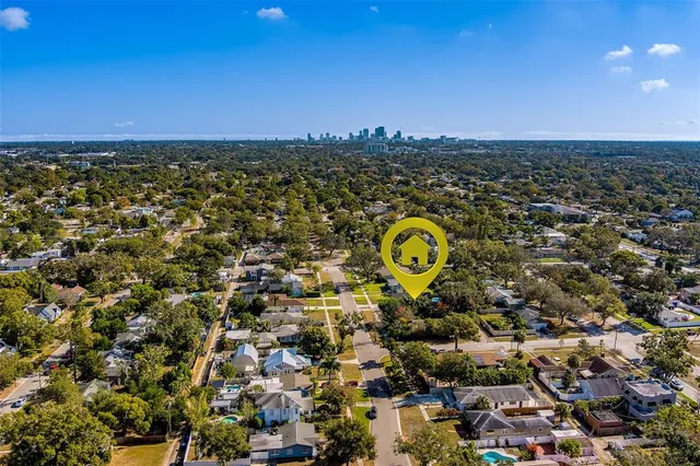 an aerial view of residential houses with outdoor space