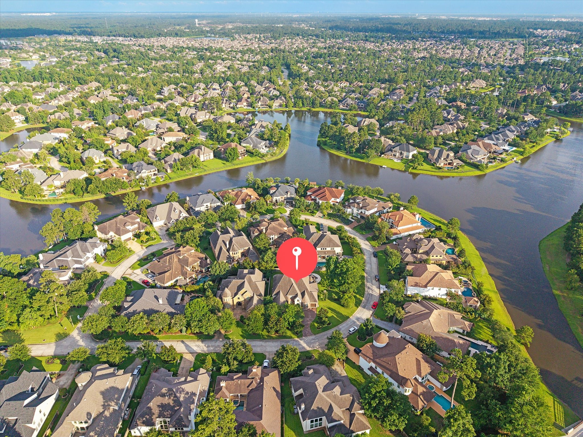 35 North Fremont Ridge Loop Spring, TX 77389 - Photo 36 of 37 Ideally positioned on a corner lot, 35 N Fremont Ridge Loop enjoys a picturesque setting surrounded by scenic lakes, mature trees, and the natural beauty that defines the Creekside Park lifestyle.