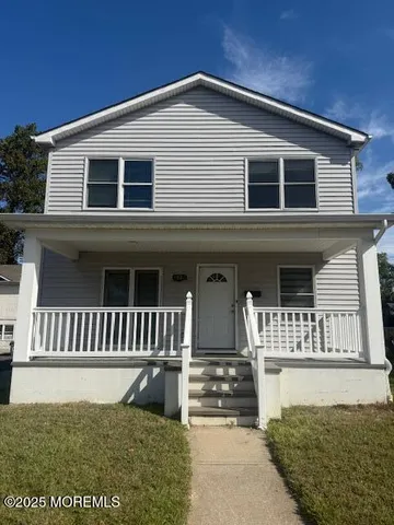 a front view of a house with a porch