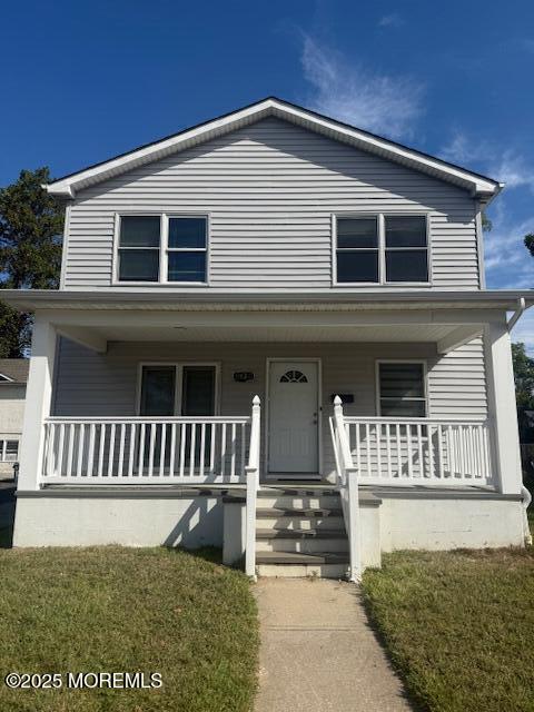 a front view of a house with a porch