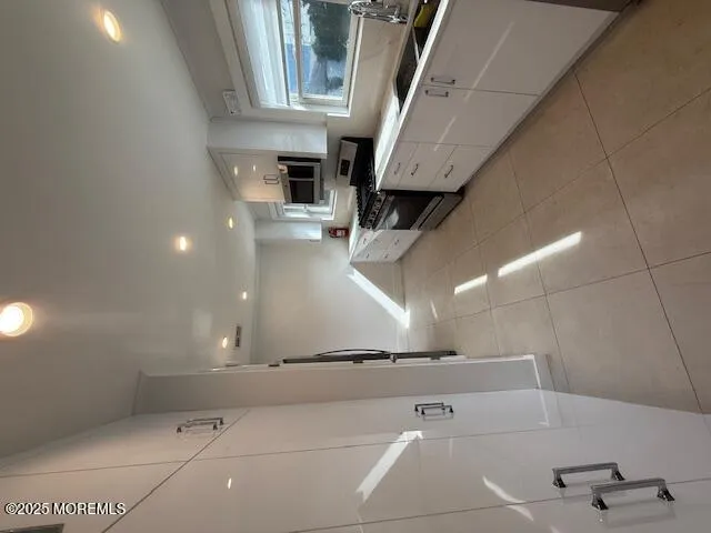 a view of an empty room with stairs