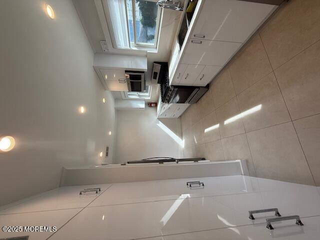 13 Wyckoff Street Deal, NJ 07723 - Photo 9 of 10 a view of an empty room with stairs