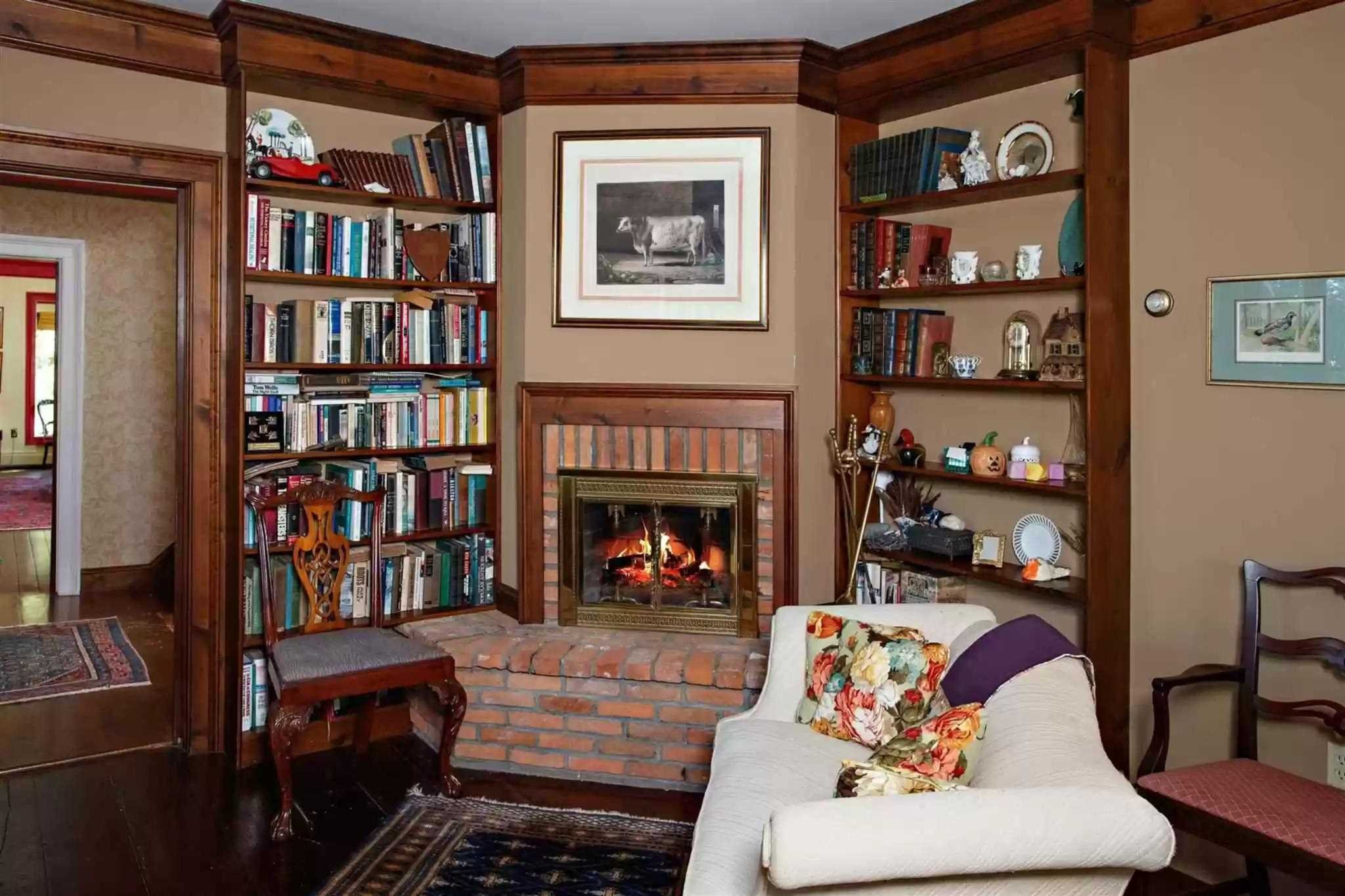 20 Barmore Road LaGrange, NY 12540 - Photo 18 of 32 a living room with fireplace furniture and a book shelf