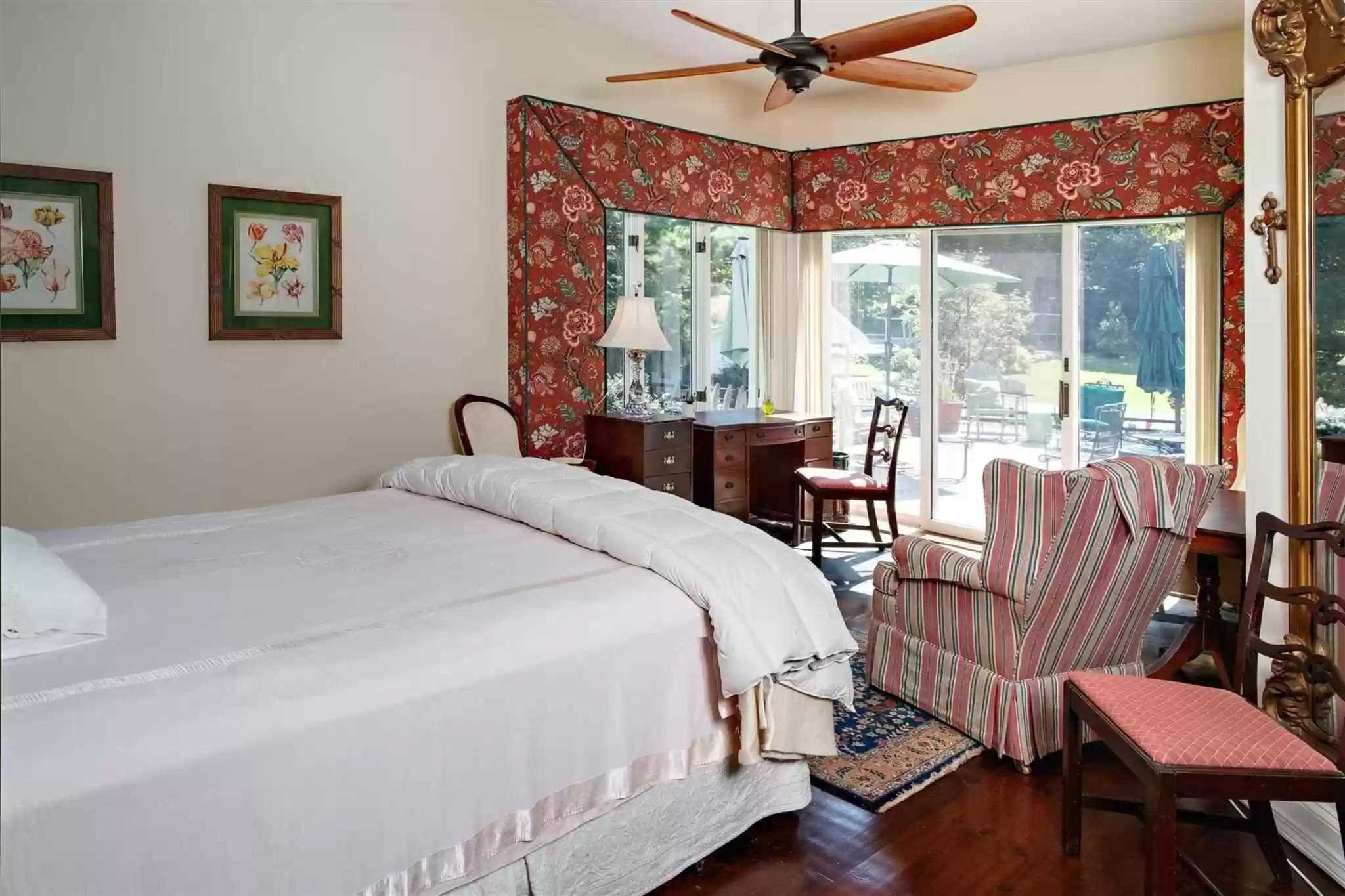 20 Barmore Road LaGrange, NY 12540 - Photo 21 of 32 a bedroom with a bed a large window with wooden floor and a potted plant