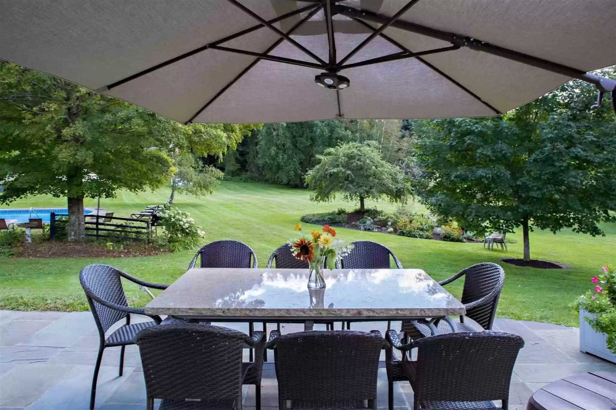 20 Barmore Road LaGrange, NY 12540 - Photo 27 of 32 a view of a patio with table and chairs under an umbrella