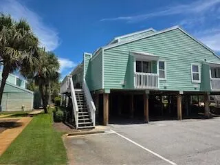 a kitchen with granite countertop a stove a sink dishwasher and a microwave oven