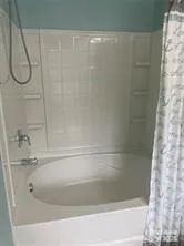 a close view of a bathtub in bathroom