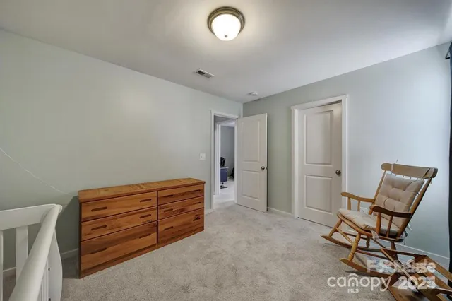 a room with furniture and a chair