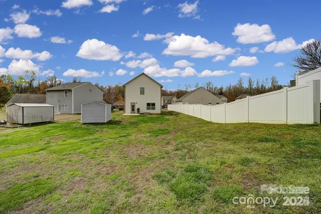a view of a patio with table and chairs with a yard