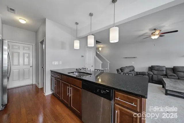 a kitchen with a counter space a sink and appliances
