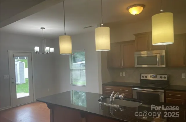 a kitchen with sink and window