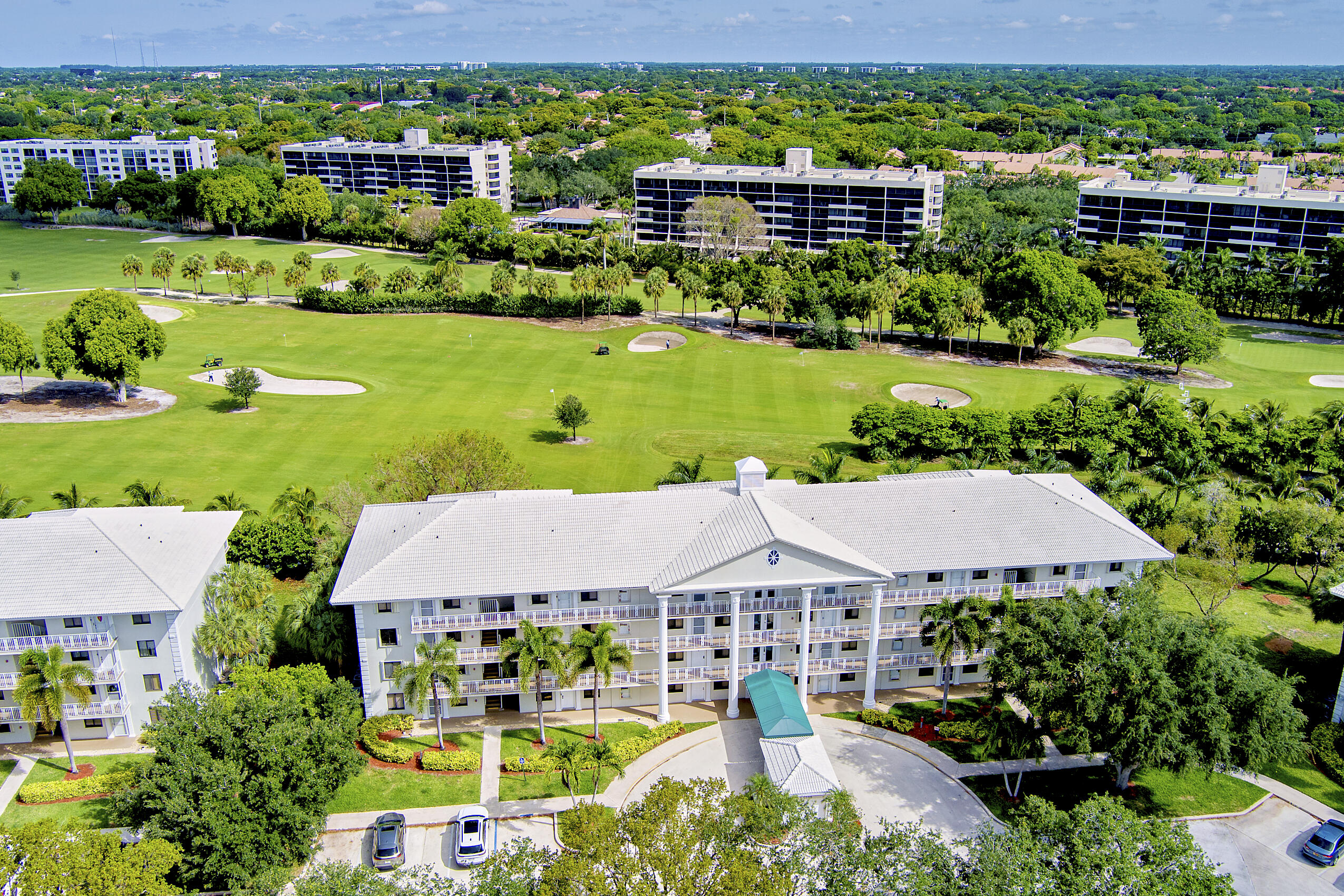 6145 Balboa Circle, Unit 103 Boca Raton, FL 33433 - Photo 1 of 31 an aerial view of a house with garden space and street view