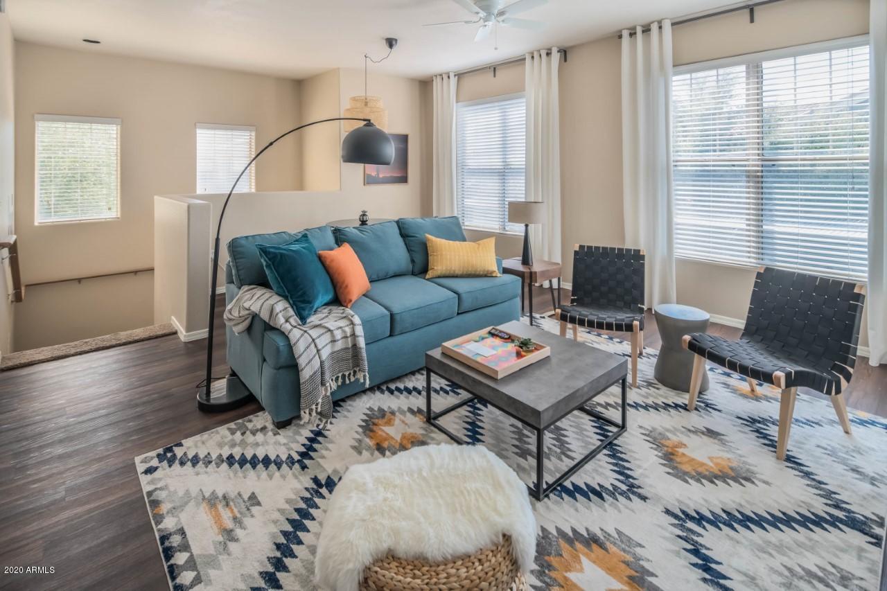 10 West Minnezona Avenue, Unit 2 Phoenix, AZ 85012 - Photo 2 of 9 a living room with furniture and a window