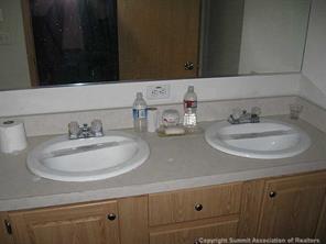 2793 Singletree Road Hartsel, CO 80449 - Photo 5 of 18 a bathroom with a sink and a mirror