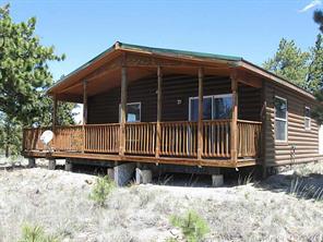 2793 Singletree Road Hartsel, CO 80449 - Photo 6 of 18 a view of a house with a wooden fence