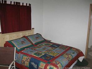 2793 Singletree Road Hartsel, CO 80449 - Photo 7 of 18 a bedroom with a bed in it