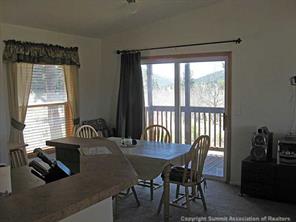 2793 Singletree Road Hartsel, CO 80449 - Photo 9 of 18 a view of a dining room with furniture window and outside view