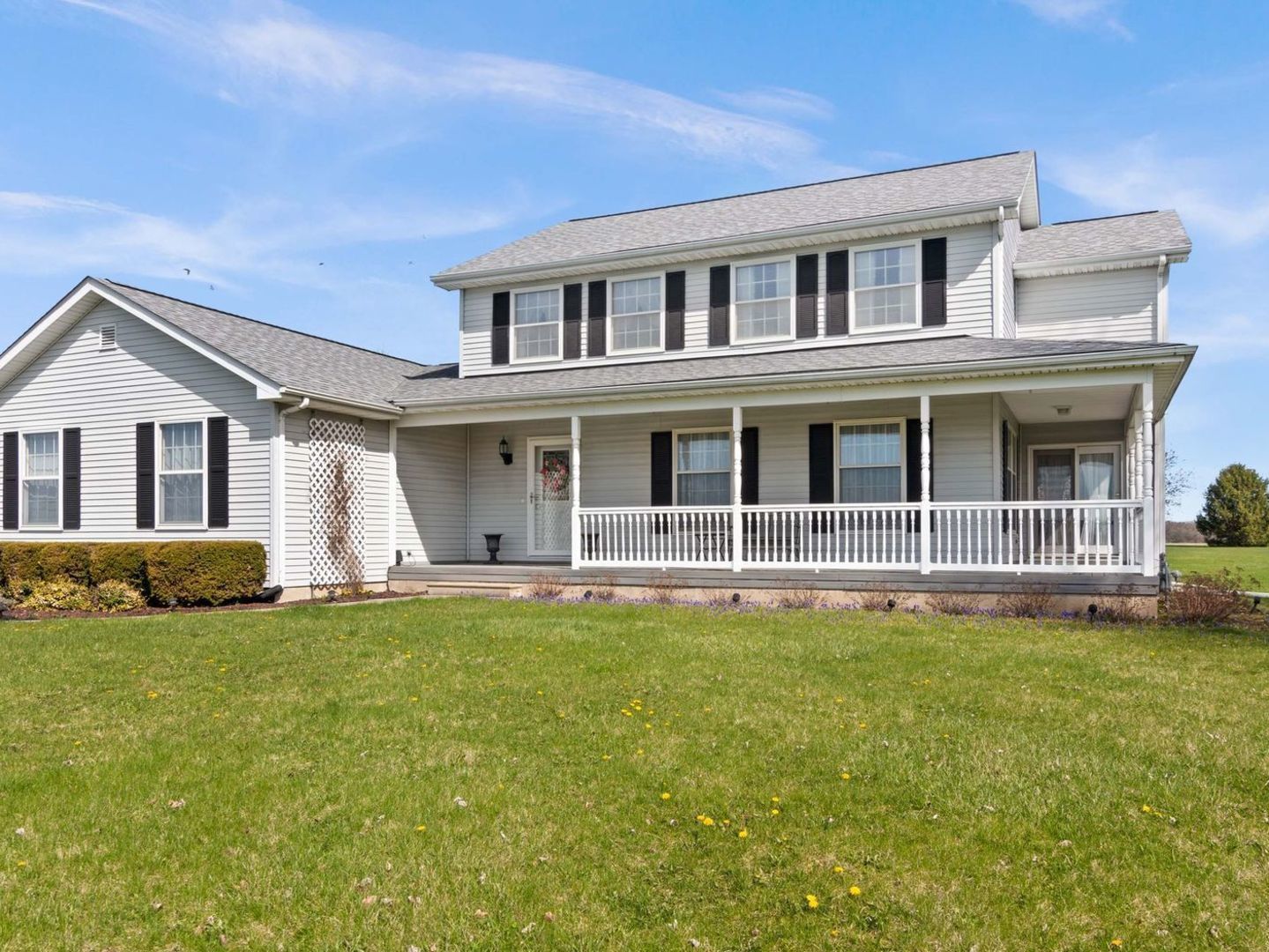 16247 Pratt Road Sandwich, IL 60548 - Photo 1 of 47 a front view of a house with a garden