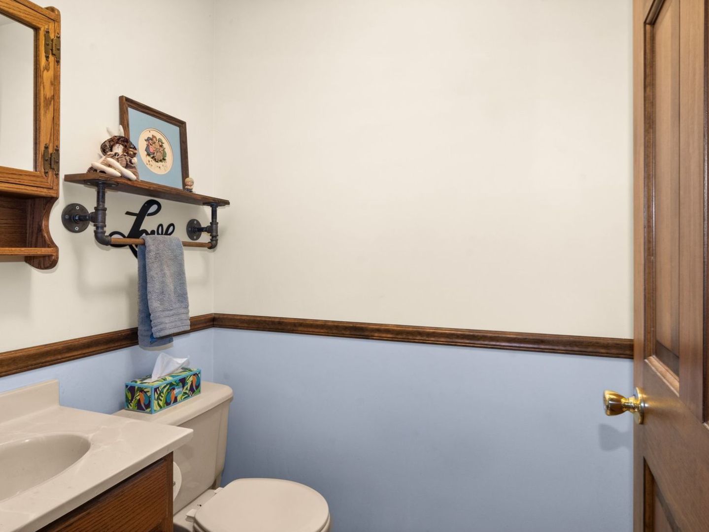 16247 Pratt Road Sandwich, IL 60548 - Photo 18 of 47 a bathroom with a sink mirror vanity and toilet