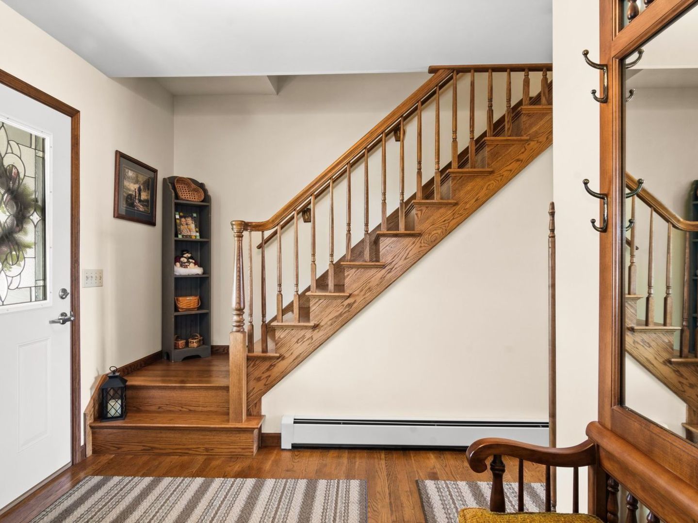 16247 Pratt Road Sandwich, IL 60548 - Photo 4 of 47 a view of staircase with wooden floor and a large window