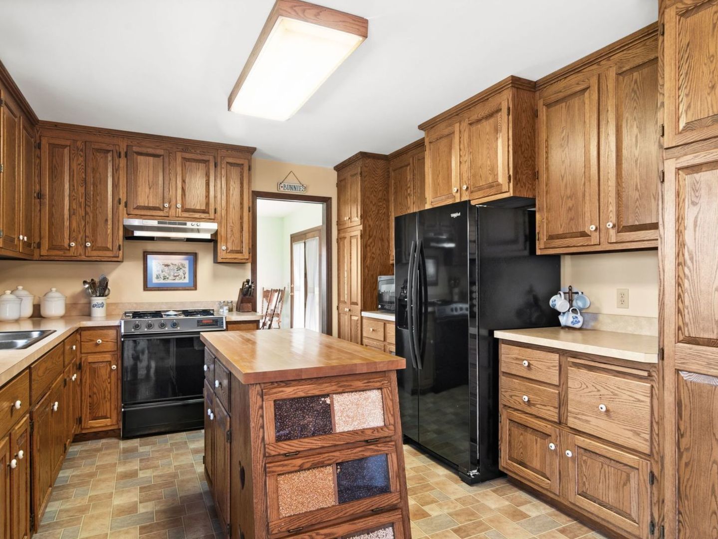 16247 Pratt Road Sandwich, IL 60548 - Photo 8 of 47 a kitchen with stainless steel appliances granite countertop a refrigerator stove and sink