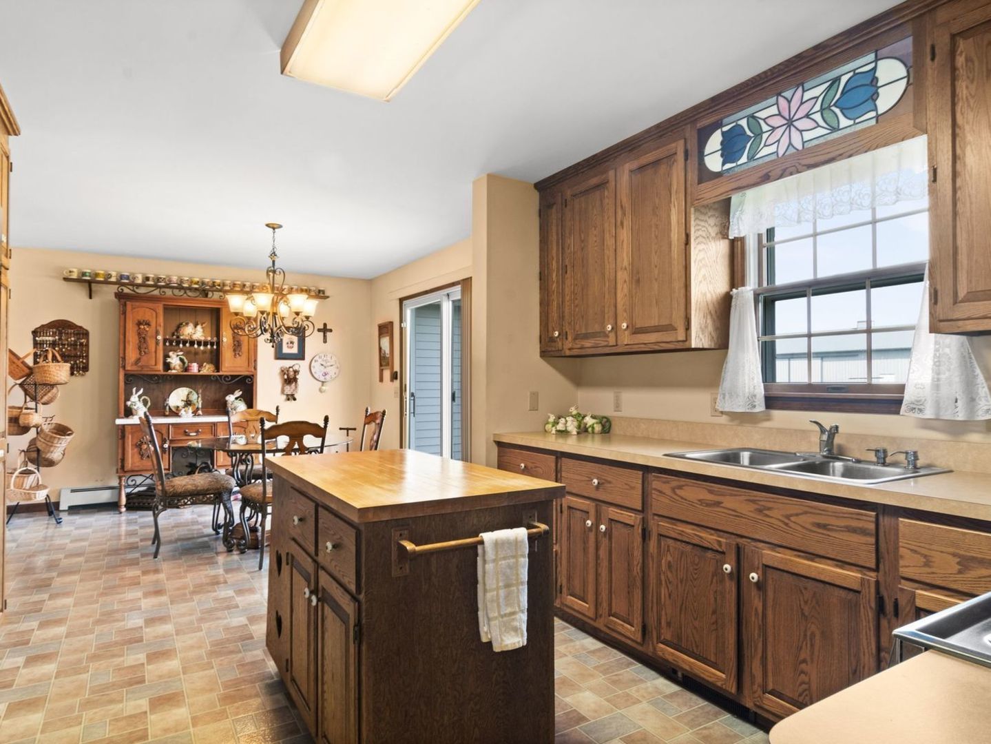 16247 Pratt Road Sandwich, IL 60548 - Photo 9 of 47 a kitchen with a sink stove and cabinets