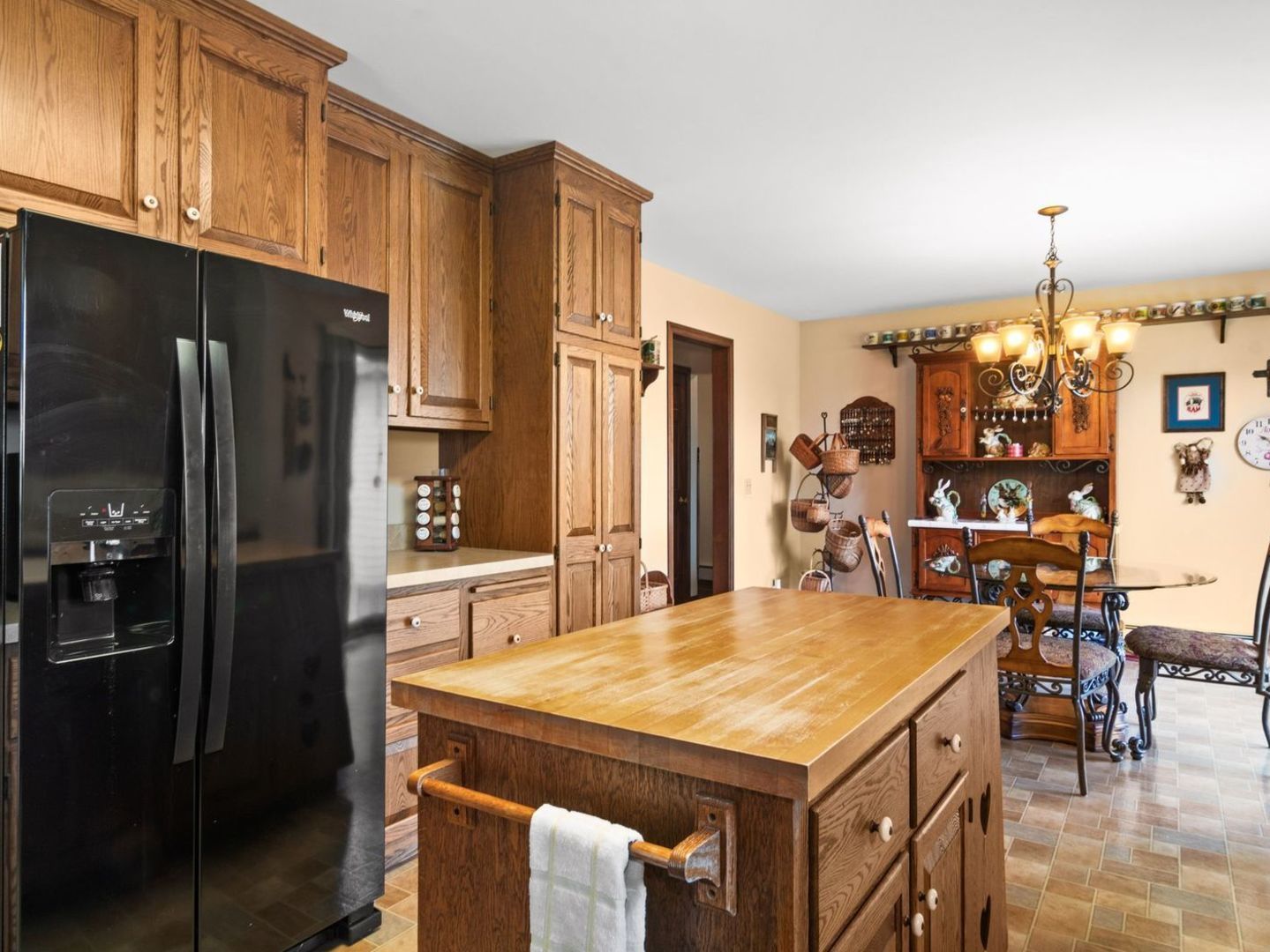 16247 Pratt Road Sandwich, IL 60548 - Photo 10 of 47 a kitchen with stainless steel appliances a refrigerator a stove a sink a dining table and chairs