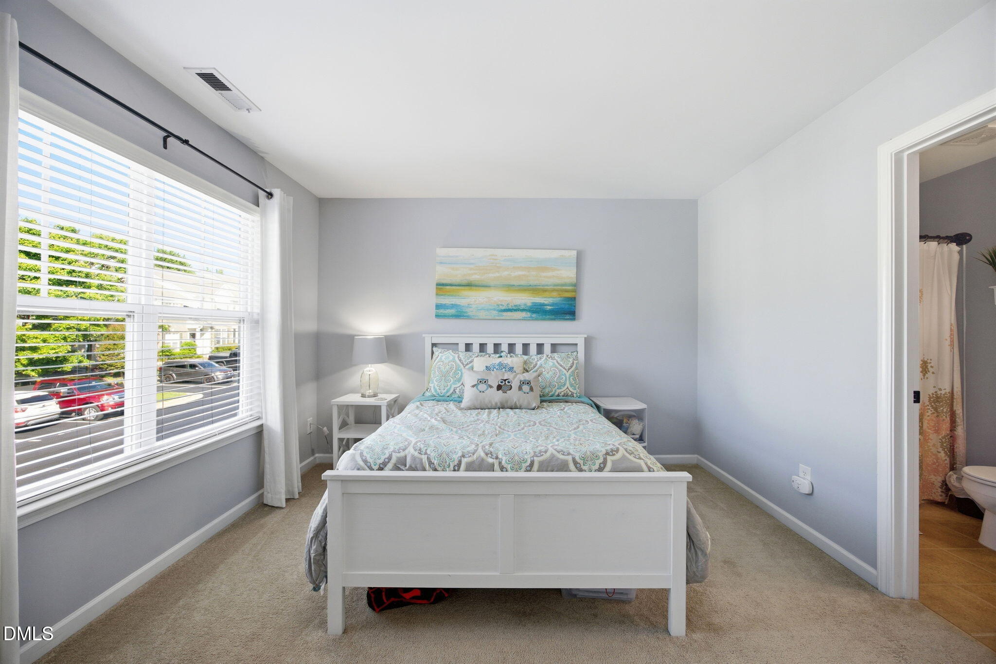 2827 Corbett Grove Drive Raleigh, NC 27616 - Photo 25 of 49 a bedroom with a large bed and a window