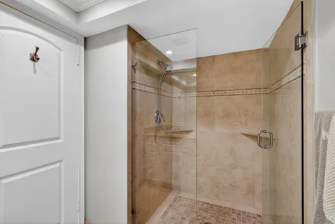 a bedroom with a bed and large window