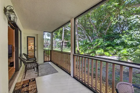 a view of a patio with swimming pool