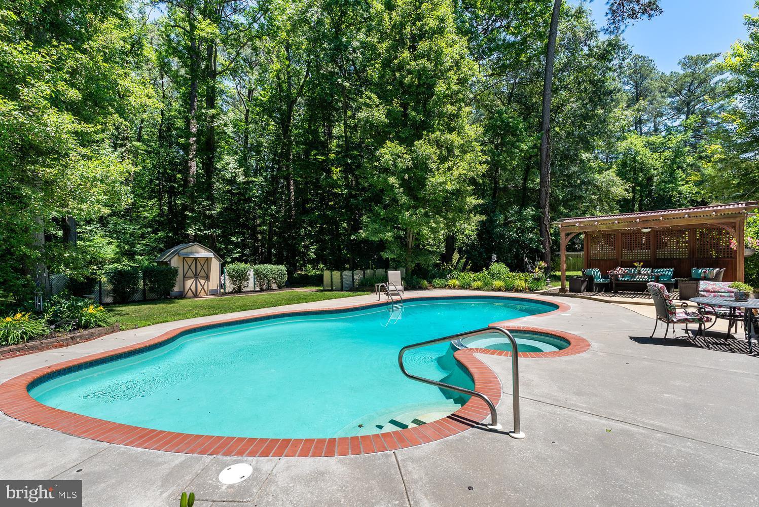 814 Wrights Neck Road Centreville, MD 21617 - Photo 16 of 53 a view of a swimming pool with chairs