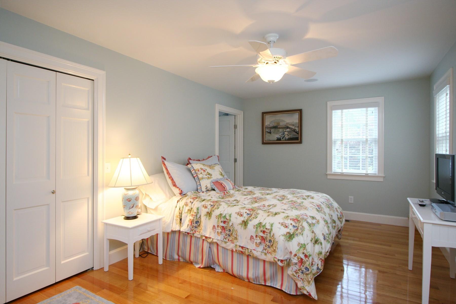 78 Neel Road Harwich Port, MA 02646 - Photo 9 of 15 a bedroom that has a bed and a table in it