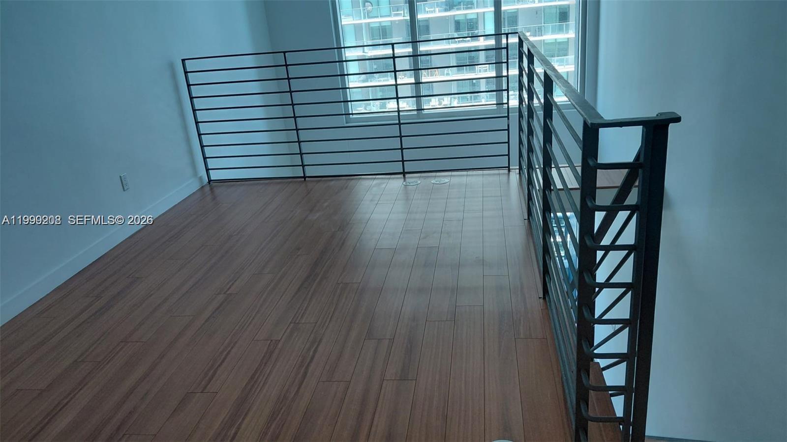 60 Southwest 13th Street, Unit 2612 Miami, FL 33130 - Photo 3 of 5 a view of a small space with racks on the wall