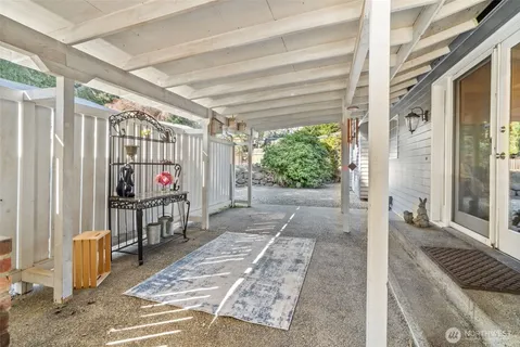 a view of a patio with table and chairs