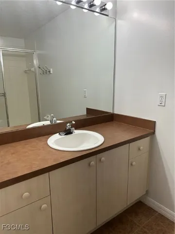 a bathroom with a sink and a mirror