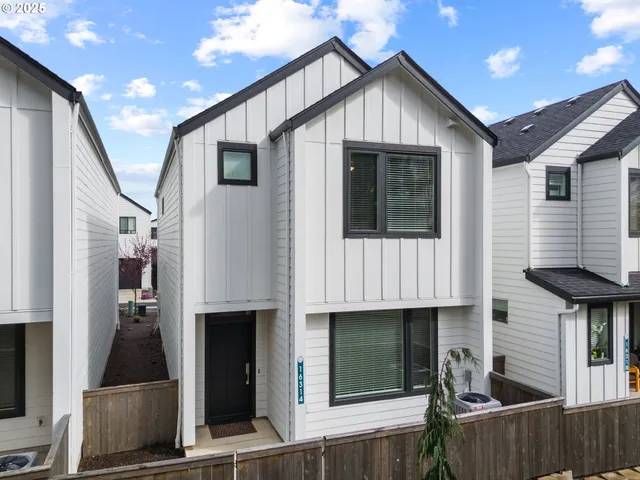 a front view of a house with garage