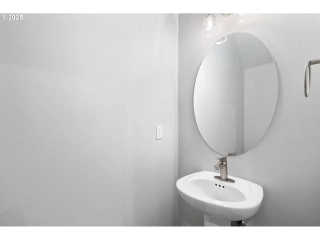 a bathroom with a sink and mirror