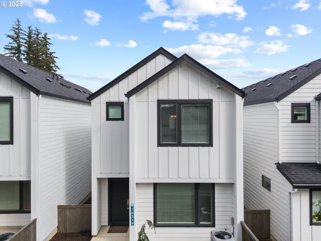 a front view of a house with garage