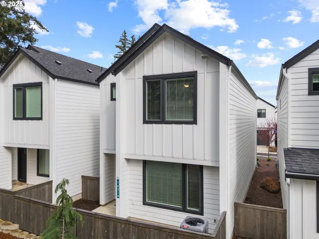 a front view of a house with garage
