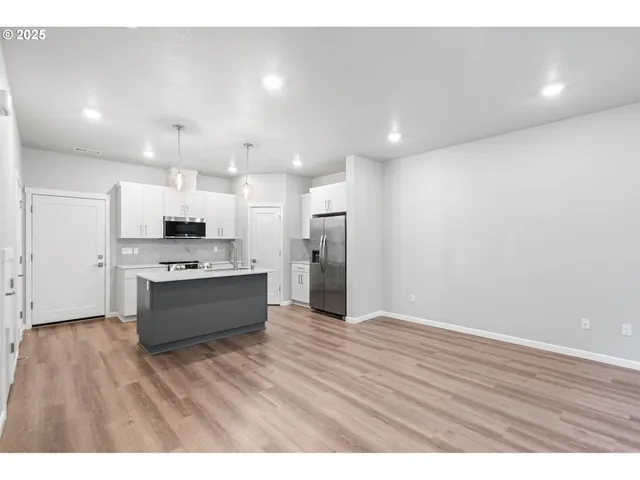 a view of kitchen with wooden floor