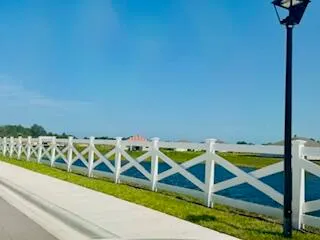 a view of swimming pool with seating space