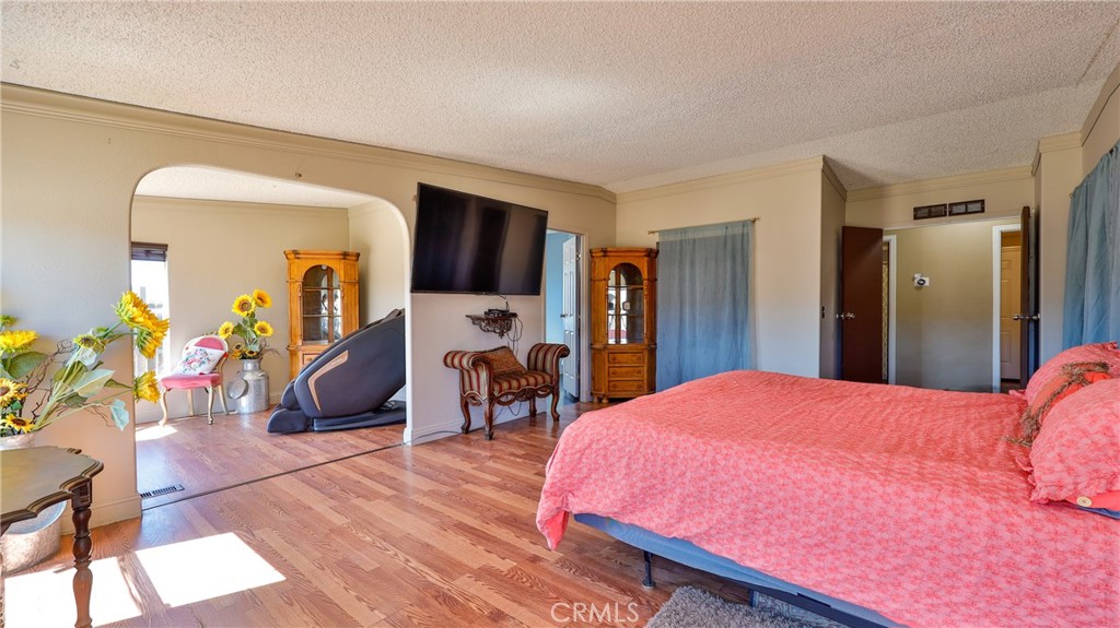 39550 Kirby Road Anza, CA 92539 - Photo 19 of 53 a bedroom with a bed and a flat tv screen on dresser