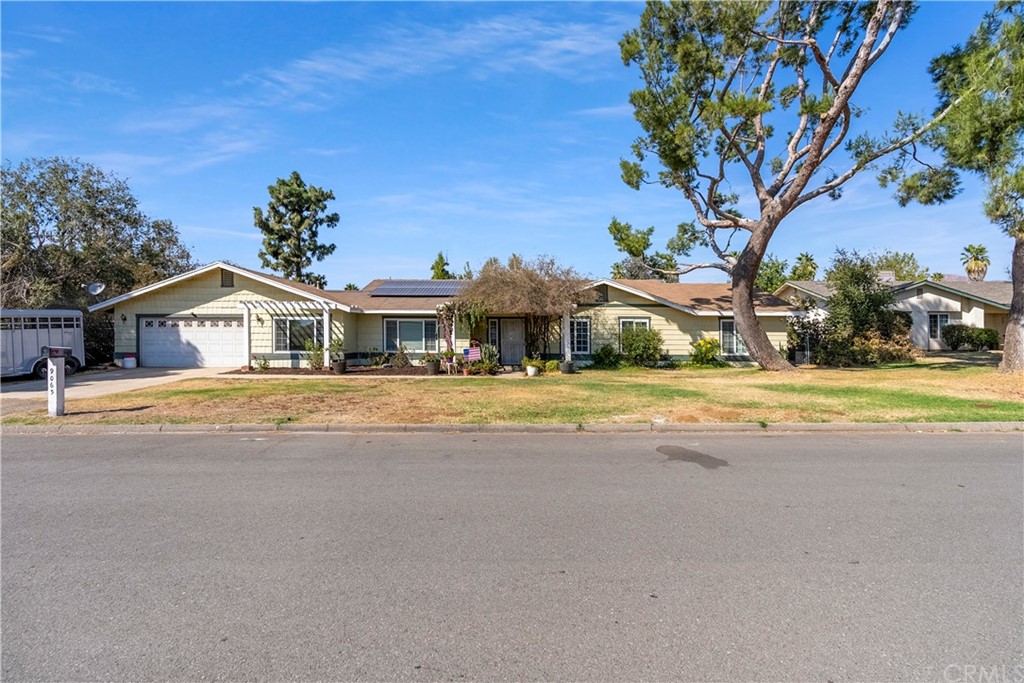 9065 Chris Court Riverside, CA 92509 - Photo 1 of 1 a front view of a house with a yard