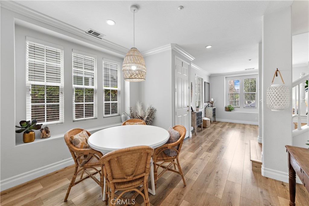 8 Bluewing Lane Ladera Ranch, CA 92694 - Photo 11 of 55 a view of a dining room with furniture window and wooden floor